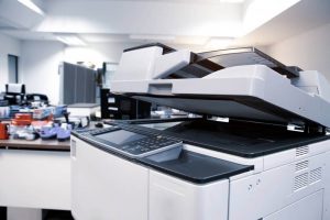 How do photocopiers and printers work?